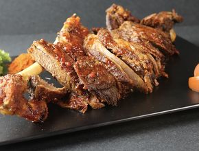 Roasted Lamb Leg Sliced on Black Slate